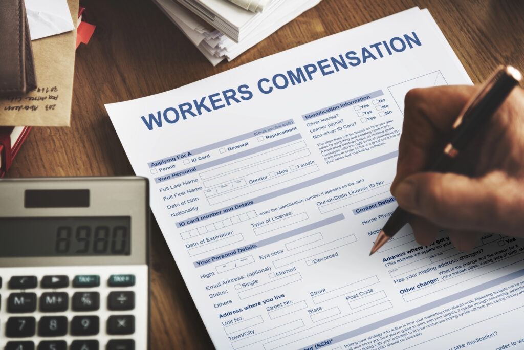 Person filling out a Missouri workers' compensation claim form